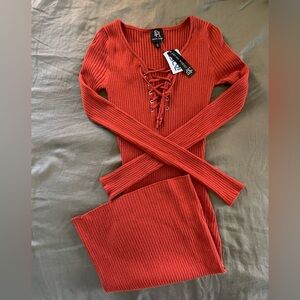 Derek Heart Ribbed Lace-Up Long Sleeve Sweater Dress in Burnt Orange